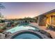 Gorgeous pool and hot tub, complemented by desert landscaping and stunning sunset views at 39089 N 102Nd Way, Scottsdale, AZ 85262