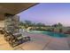 A beautiful pool and deck with relaxing lounge chairs set in serene desert surroundings at 39089 N 102Nd Way, Scottsdale, AZ 85262