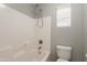 Clean white tiled tub and shower combination at 408 W Sweet Shrub Ave, San Tan Valley, AZ 85140