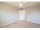 Bedroom with open door and ceiling fan at 408 W Sweet Shrub Ave, San Tan Valley, AZ 85140