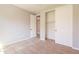 Neutral bedroom with carpet, closet, and door to another room at 408 W Sweet Shrub Ave, San Tan Valley, AZ 85140