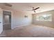Large loft with ceiling fan, TV mount, and lots of natural light at 408 W Sweet Shrub Ave, San Tan Valley, AZ 85140