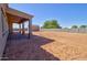 Large backyard featuring a covered patio and ample space for landscaping and recreation at 4080 N Turquoise Dr, Eloy, AZ 85131
