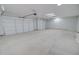 Spacious three-car garage featuring durable concrete floors and high ceilings, perfect for storage at 4080 N Turquoise Dr, Eloy, AZ 85131
