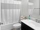 Bathroom with a shower-tub combo, modern vanity, and toilet, providing a functional space at 42087 W Manderas Ln, Maricopa, AZ 85138