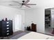 Bright main bedroom featuring carpeted floors, neutral walls, and a walk-in closet for optimal storage at 42087 W Manderas Ln, Maricopa, AZ 85138