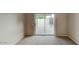 Bright bedroom featuring sliding doors to a patio area with carpet floors at 4776 W Eva St, Glendale, AZ 85302