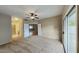A spacious bedroom features neutral carpet, a ceiling fan, and sliding glass doors at 4776 W Eva St, Glendale, AZ 85302