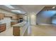 Well-lit kitchen area featuring granite countertops and modern appliances at 4776 W Eva St, Glendale, AZ 85302