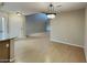 Inviting open living and dining area, bright with wood floors and chandelier at 4776 W Eva St, Glendale, AZ 85302