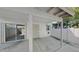 Covered patio featuring a sliding glass door, security door and privacy walls at 4776 W Eva St, Glendale, AZ 85302