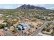 Aerial view of property, nearby neighborhood, and Papago Mountain in the background at 6529 N Mountain View Dr, Paradise Valley, AZ 85253