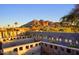 Scenic backyard with decorative concrete block walls, desert landscaping, and stunning mountain views at 6529 N Mountain View Dr, Paradise Valley, AZ 85253