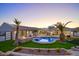 Stunning backyard oasis with pool, lush landscaping, and outdoor living space at 6529 N Mountain View Dr, Paradise Valley, AZ 85253