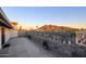 Inviting front patio with privacy wall and stunning mountain views at sunset at 6529 N Mountain View Dr, Paradise Valley, AZ 85253