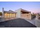 Stylish garage with sleek glass doors complements the home's modern exterior and driveway at 6529 N Mountain View Dr, Paradise Valley, AZ 85253