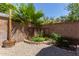 Backyard garden bed with retaining wall featuring decorative landscaping elements at 10807 W Morten Ave, Glendale, AZ 85307
