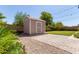 Cozy backyard storage shed with string lights and patio area, perfect for outdoor living at 10807 W Morten Ave, Glendale, AZ 85307