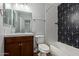 Modern bathroom with tub shower combo and stylish geometric tile at 10807 W Morten Ave, Glendale, AZ 85307