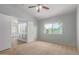 Bright bedroom features large window and doorway to separate room at 10807 W Morten Ave, Glendale, AZ 85307