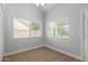 Bright bedroom with window and wood-look flooring at 10807 W Morten Ave, Glendale, AZ 85307