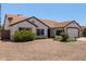 Charming single-story home featuring well-maintained landscaping and a two-car garage at 10807 W Morten Ave, Glendale, AZ 85307