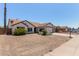 Lovely single-story home boasting desert landscaping, a two-car garage, and a welcoming entrance at 10807 W Morten Ave, Glendale, AZ 85307