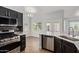 Modern kitchen with stainless steel oven, dishwasher and beautiful tile backsplash at 10807 W Morten Ave, Glendale, AZ 85307