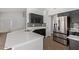 Modern kitchen features stainless steel appliances, granite counters, and sleek black cabinetry at 10807 W Morten Ave, Glendale, AZ 85307