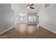 Spacious living room featuring vaulted ceilings, stylish lighting, and wood-look flooring at 10807 W Morten Ave, Glendale, AZ 85307