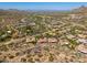 Scenic aerial view of a home in a sprawling desert community, boasting panoramic mountain views at 11070 E Bent Tree Dr, Scottsdale, AZ 85262