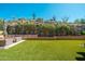 Stunning backyard featuring artificial grass and rock wall landscaping, perfect for outdoor enjoyment at 11070 E Bent Tree Dr, Scottsdale, AZ 85262