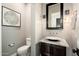 Powder room boasts granite countertop, bowl sink, and decorative wall sconces at 11070 E Bent Tree Dr, Scottsdale, AZ 85262