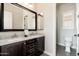 Bathroom features dual sinks, a large mirror, and separate toilet/shower area at 11070 E Bent Tree Dr, Scottsdale, AZ 85262