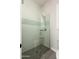 Modern shower features glass enclosure, mosaic tile accent, and tiled bench at 11070 E Bent Tree Dr, Scottsdale, AZ 85262