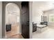 Luxurious bathroom offers a soaking tub, separate vanities, and a barn door entrance at 11070 E Bent Tree Dr, Scottsdale, AZ 85262
