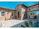 Beautiful outdoor courtyard with a seating area, lush plants, and striking brickwork, perfect for relaxing and entertaining at 11070 E Bent Tree Dr, Scottsdale, AZ 85262