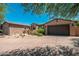 Charming single-story home featuring a three-car garage and desert landscaping for low maintenance appeal at 11070 E Bent Tree Dr, Scottsdale, AZ 85262