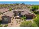 Charming home with lush desert landscaping featuring vibrant greenery and cacti, enhancing its curb appeal at 11070 E Bent Tree Dr, Scottsdale, AZ 85262