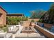 Inviting backyard firepit area with comfortable seating and ambient lighting, perfect for cozy evenings at 11070 E Bent Tree Dr, Scottsdale, AZ 85262