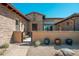 Inviting front entrance with a gated courtyard and desert-friendly landscaping for enhanced curb appeal at 11070 E Bent Tree Dr, Scottsdale, AZ 85262