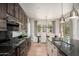 Well-lit kitchen features granite countertops, gas cooktop, and stainless steel appliances at 11070 E Bent Tree Dr, Scottsdale, AZ 85262
