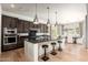 Modern kitchen with an island, stainless steel appliances, and sleek countertops at 11070 E Bent Tree Dr, Scottsdale, AZ 85262