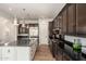 Spacious kitchen boasts granite countertops, stainless steel appliances, and stylish pendant lighting at 11070 E Bent Tree Dr, Scottsdale, AZ 85262