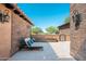 Inviting patio with comfortable lounge chairs, a charming fire feature, and stylish outdoor lighting at 11070 E Bent Tree Dr, Scottsdale, AZ 85262