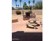 Backyard featuring a built-in barbeque island and decorative seating area at 11210 W Alvarado Rd, Avondale, AZ 85392