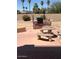 Backyard featuring a built-in barbeque island and decorative seating area at 11210 W Alvarado Rd, Avondale, AZ 85392