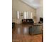 Inviting living room with hardwood floors and plantation shutters at 11210 W Alvarado Rd, Avondale, AZ 85392