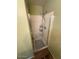 Shower stall with glass doors and shelving at 11210 W Alvarado Rd, Avondale, AZ 85392