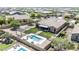 Aerial view of home with backyard featuring a pool, spa, patio, outdoor kitchen, and mature trees at 12710 W Forest Pleasant Pl, Peoria, AZ 85383
